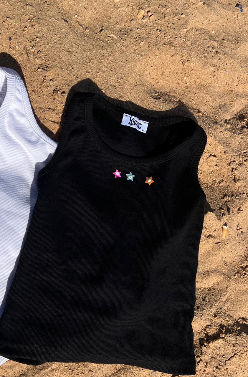 black tank top with toys